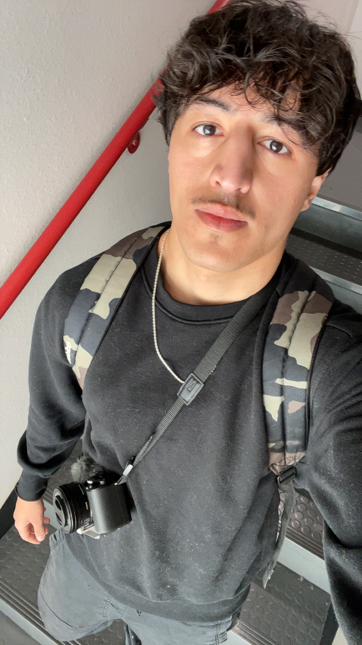 The founder of bisbis creatives holding a camera